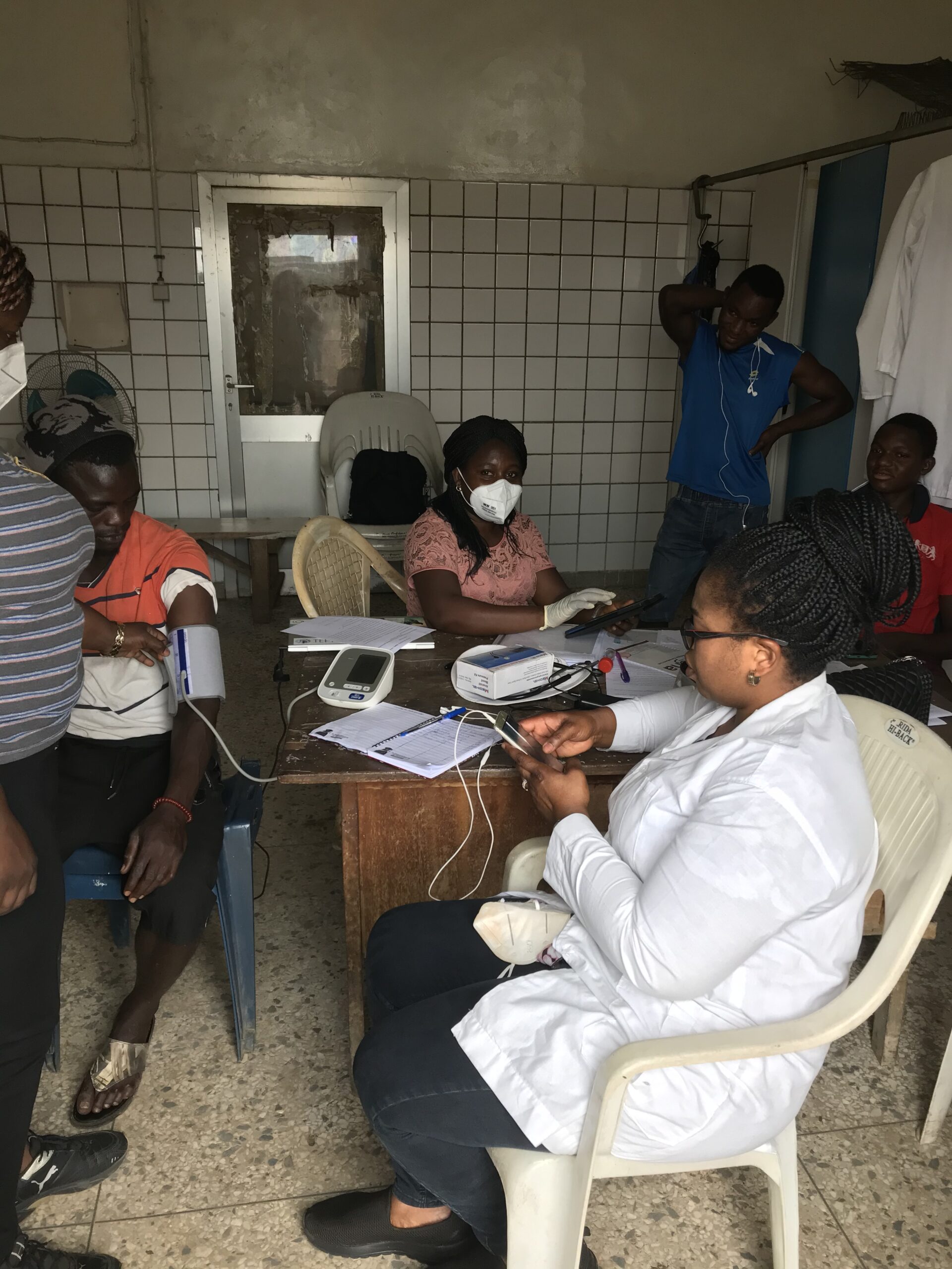 Mabel and Damilola (AMU) Fellow providing health checks for abattoir workers in Lagos.