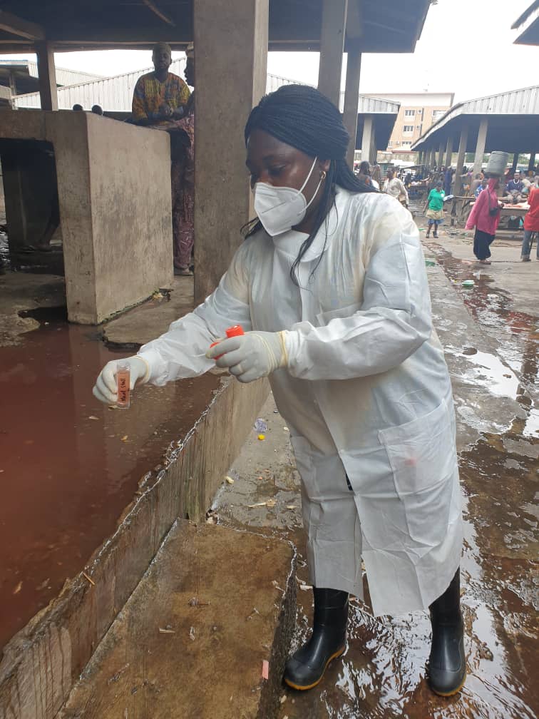 Mabel collecting abattoir wastewater samples in Lagos.