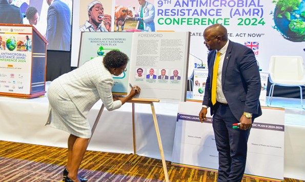 Ugandan Minister of Health, Dr Jane Aceng, signs the new National Action Plan (NAP) 2024-2029, which incorporates gender and equity considerations.